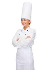 smiling female chef with crossed arms