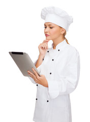 smiling female chef with tablet pc computer