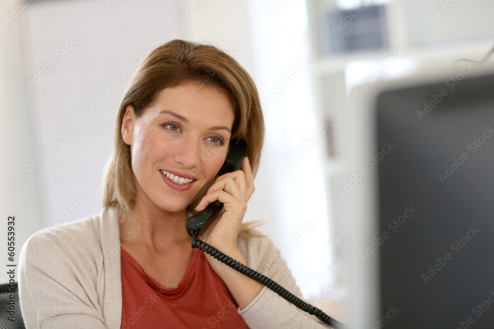 Sticker Businesswoman in office talking on the phone