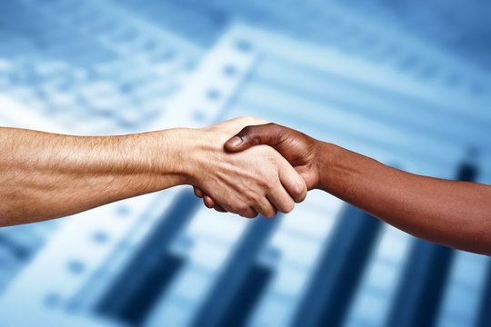 Handshake between multiracial people
