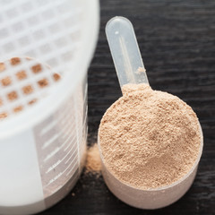 Scoop of chocolate whey isolate protein