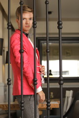 Young handsome stylish man posing indoor