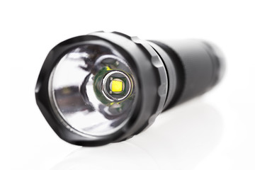 Professional LED flashlight isolated on white background