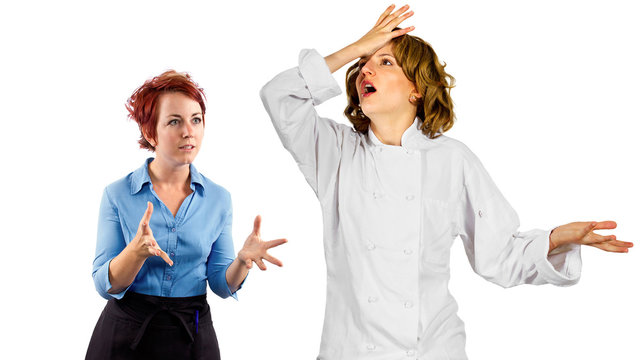 young female chef and waitress co-workers fighting