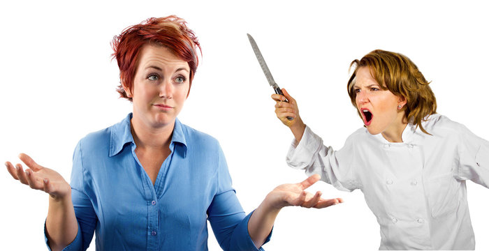 young female chef and waitress co-workers fighting
