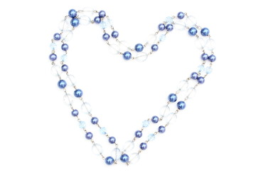 Heart of blue shiny necklace on white background