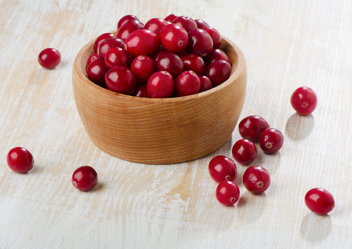 Cranberries on wooden table