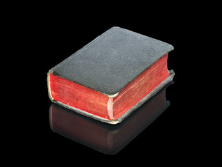 old and antique book isolated on black