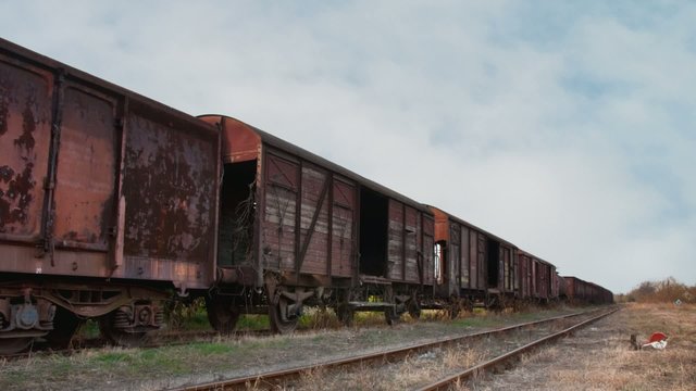 Old train with cargo containers in the station