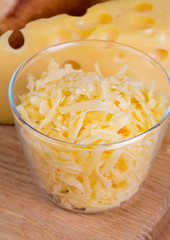 grated cheese on wooden table