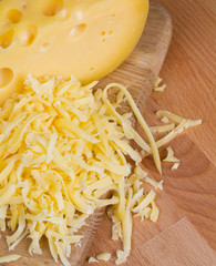 grated cheese on wooden table