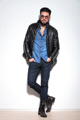 full body picture of a casual man in leather jacket