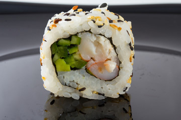 Sushi roll with sesame