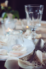vintage table setting with rose petals