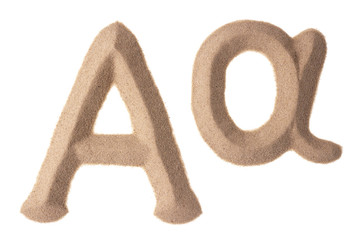 Alpha sign written with sand