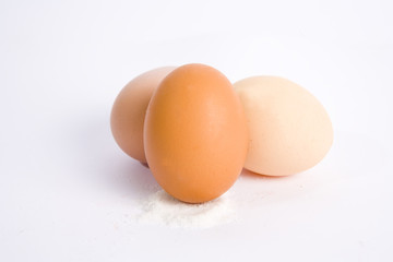 Three eggs on white ground