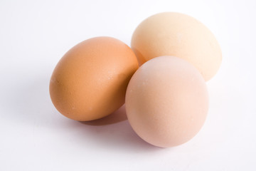 Three eggs on white ground