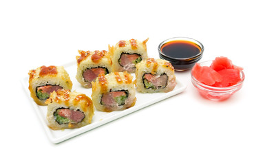 Japanese rolls on a plate isolated on white background