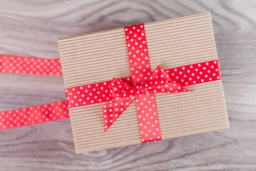 Wrapped gift box on wood