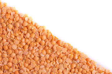 Orange lentils on white background