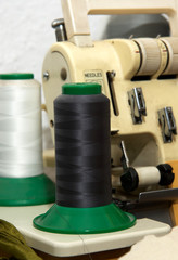 Closeup to vintage sewing machine and thread spool