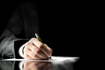 Businessman signing a document