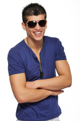 Happy handsome young man wearing dark sunglasses