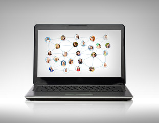 laptop computer with social network on screen