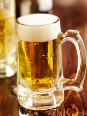 large mug of beer on wood counter