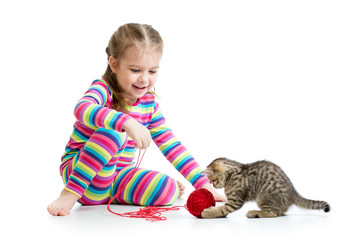 child girl playing with kitten isolated on white background