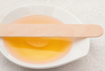 beauty wax with wooden spatula