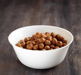 Bowl of chocolate cereal on a table