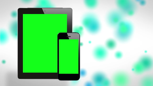 Tablet and smartphone on cool background. Green screen