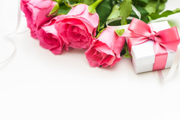 Bouquet of roses and gift box