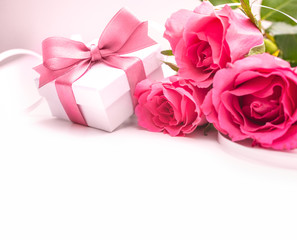 Bouquet of roses and gift box