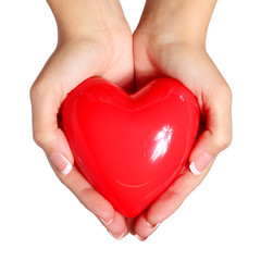 Obraz premium Red heart in female hands, isolated on white background. Love