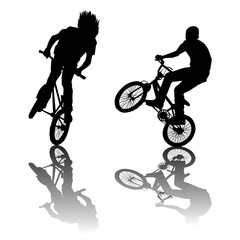 Obraz premium Silhouettes of bikers doing tricks