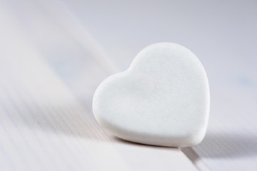 Fototapeta premium White heart on white wood