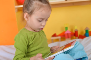 small girls with tablet