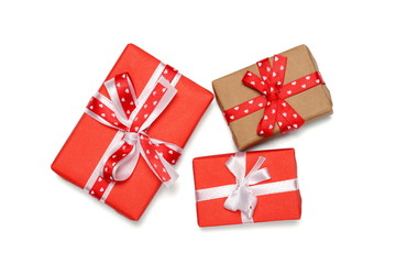 three gift boxes with ribbon bows, isolated on white