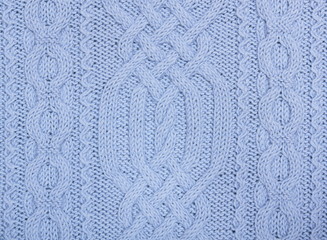 Knit woolen texture. Blue fabric