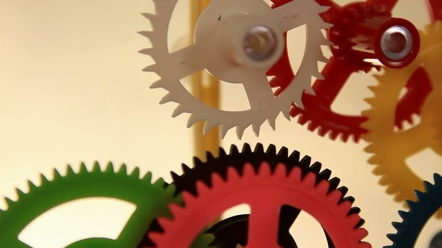 working multicolor plastic toy cog of clockwork