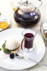 dessert, a piece of cake on the table with a cup of tea