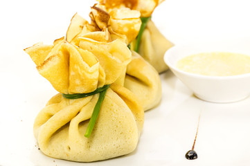 pancakes with meat on a table in a restaurant