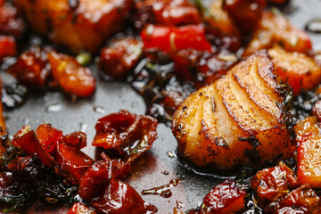 Grilled salmon in herbs on frying pan