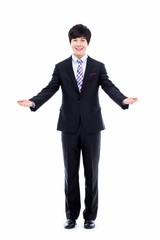 Young Asian business man showing welcom sign.