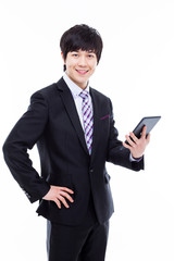 Young Asian business man using a pad PC