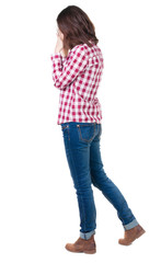 Back view of shocked woman in checkered shirt