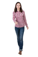 back view of walking  woman in checkered shirt.