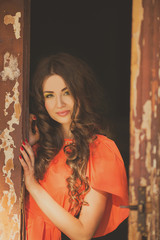 Portrait of a beautiful young woman with long hair outdoors